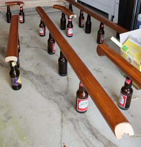 Wooden railing on beer bottles