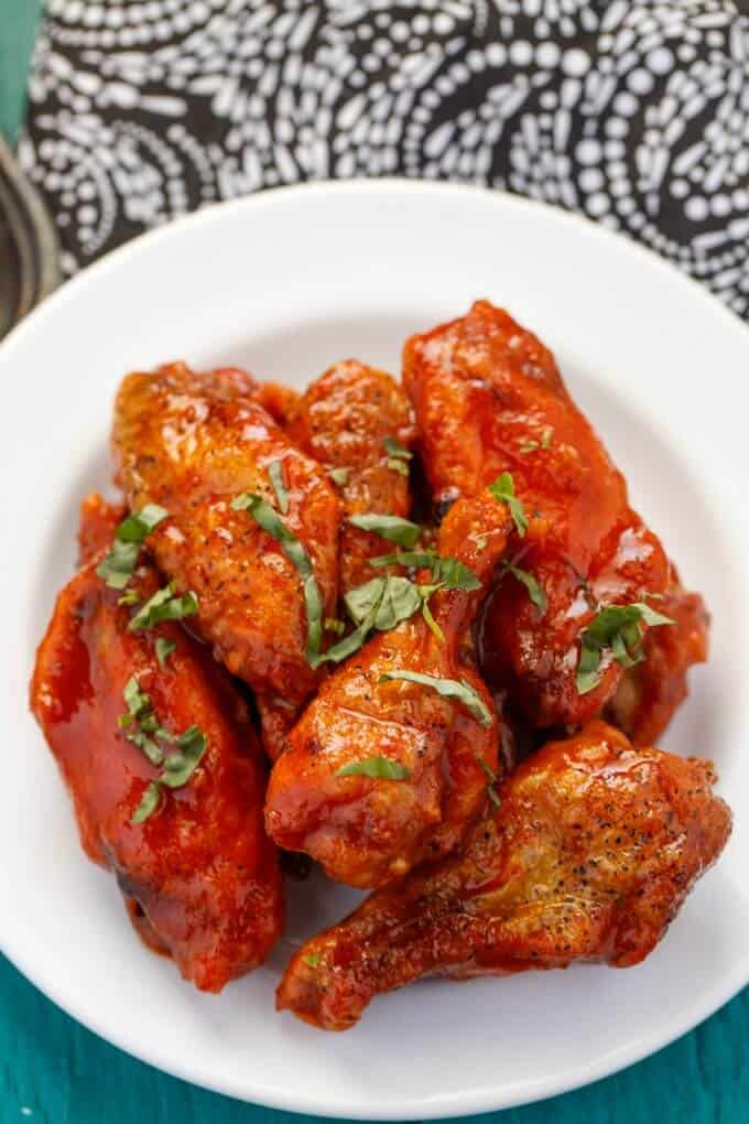 Baked Sriracha Chicken Wings on white plate top view