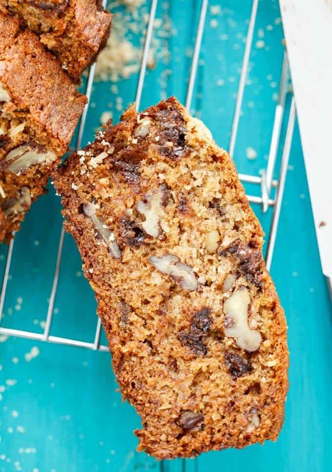 Chocolate Chip Banana Bread with Coconut and Nuts sliced on blue background #bananas