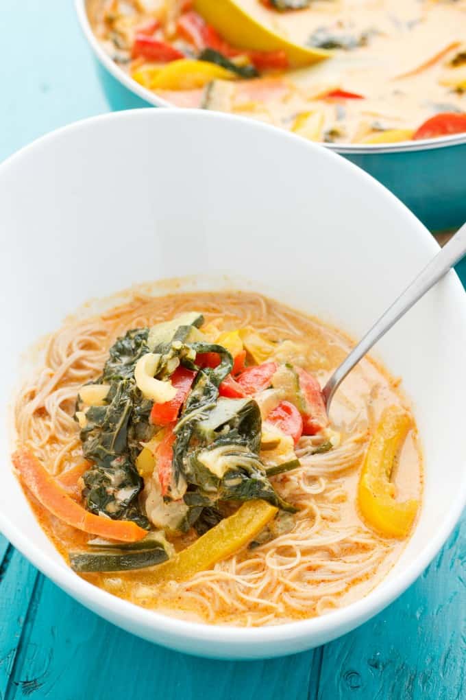 Coconut Curry Soup over Vermicelli Rice Noodles in white bowl with fork on blue table #healthy