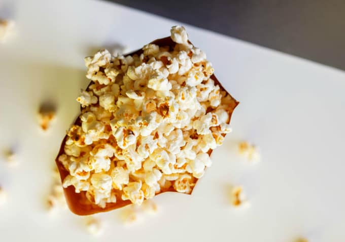 Healthy Stove Top Popcorn  in paper bag in table top view