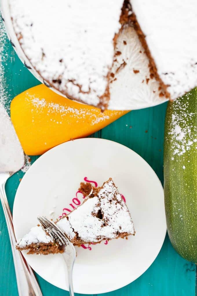 Chocolate Zucchini Cake  on white plate cutted by fork, top view#sugar