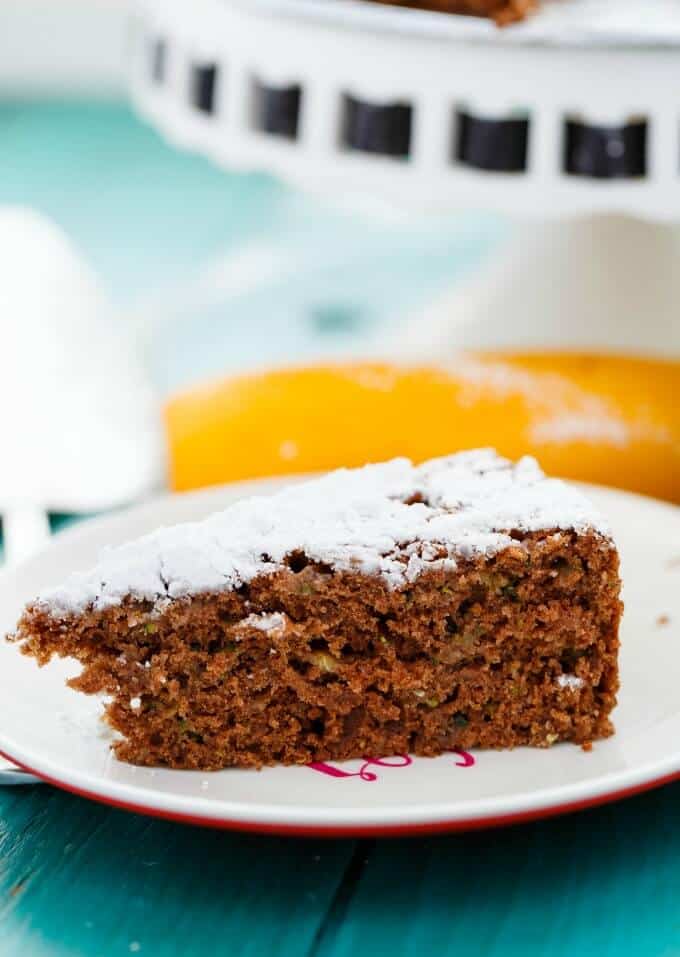 Chocolate Zucchini Cake  on white plate on blue table#zucchini