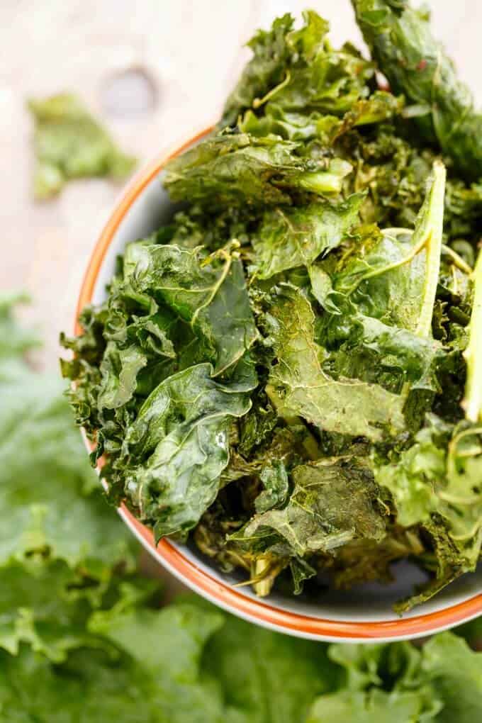 Coconut Oil Kale Chips  in bowl, top view#kale