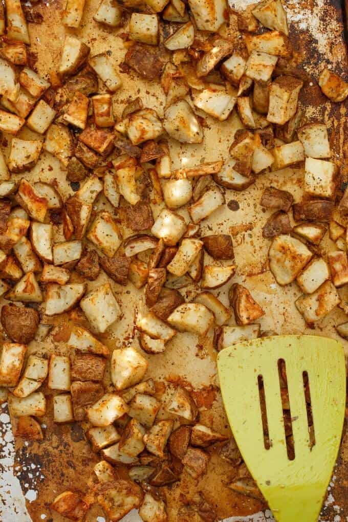 Easy and basic roastedpotatoes with green spatula top view