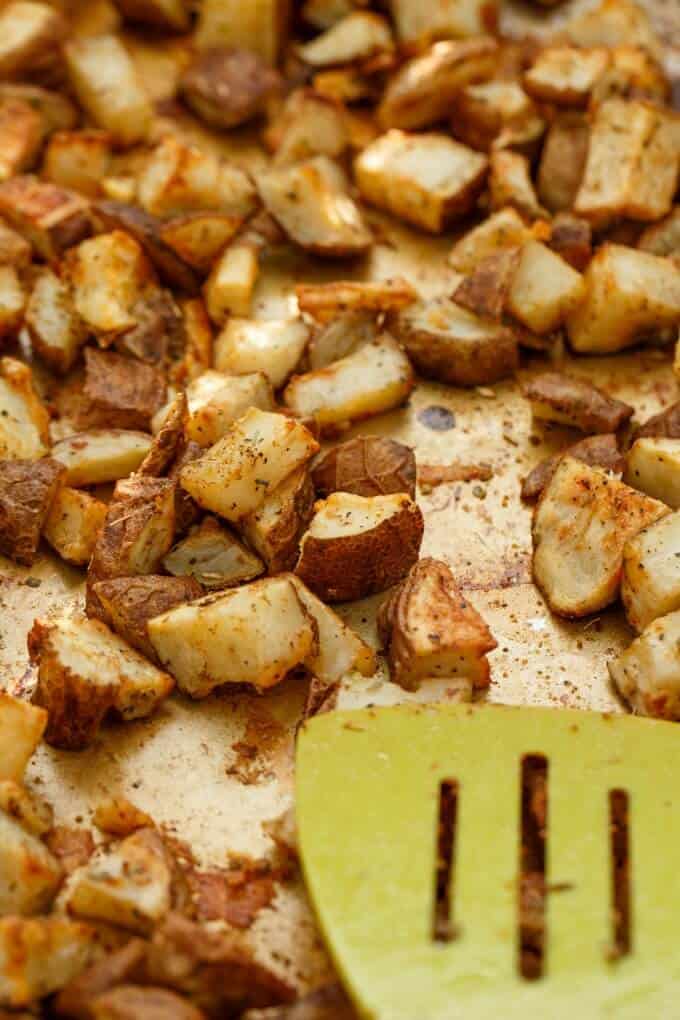 Easy and Basic Roasted Potatoes with green spatula