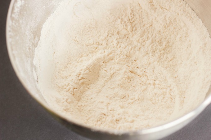 Flour in bowl, gray background