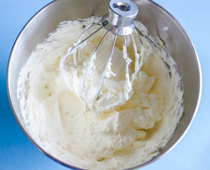 Meringue buttercream being mixed in bowl