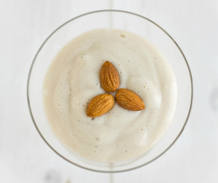 Almond whipped cream with almonds in glass