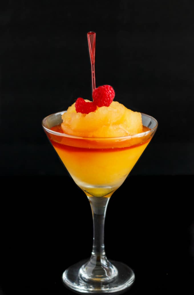 Milestones Bellini in glass with raspberries