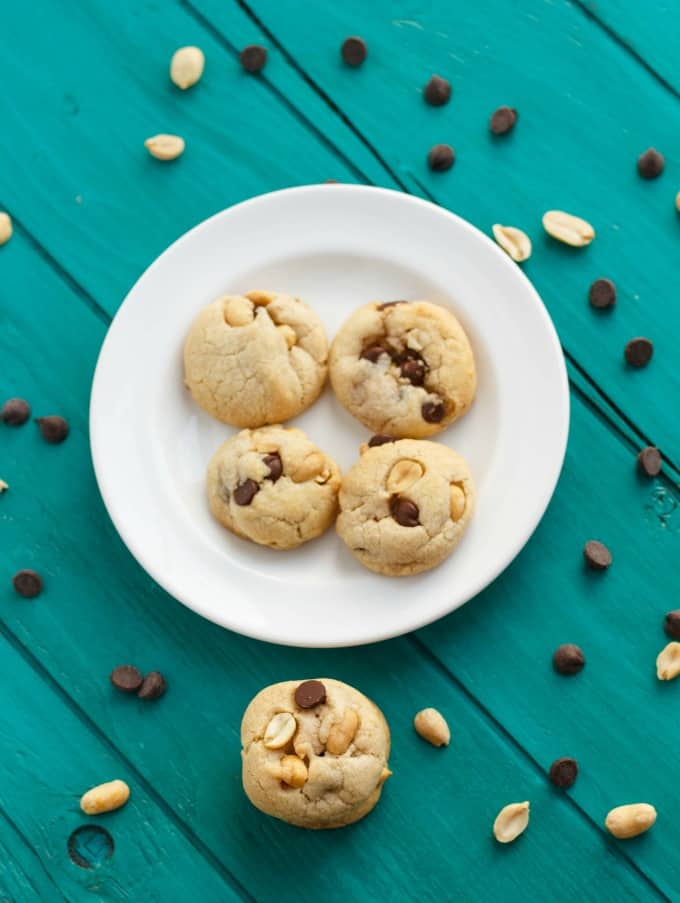 No Butter Chocolate Chip Cookies with Peanuts on white plate on blue table#chocolatechipcookies