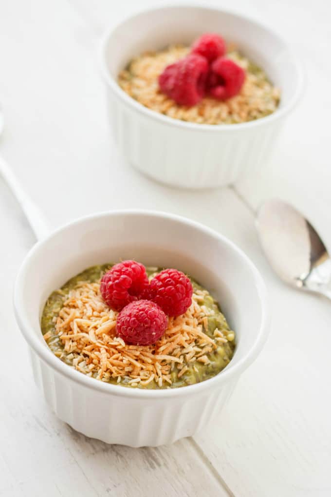 Vegan Green Tea Chia Seed Pudding in white bowls with raspberries
