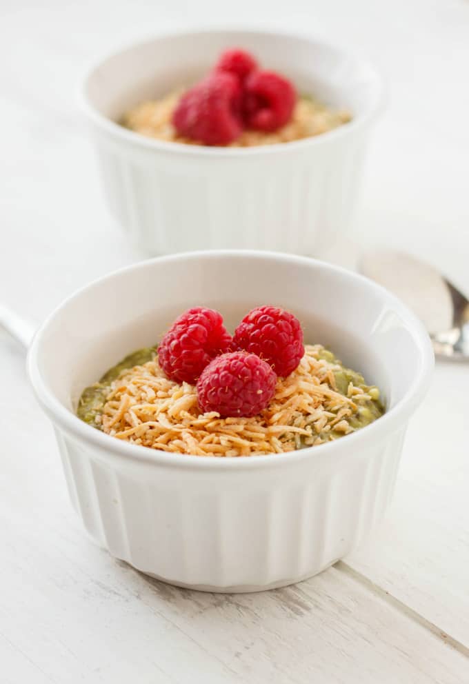 Vegan Green Tea Chia Seed Pudding in white bowls with raspberries