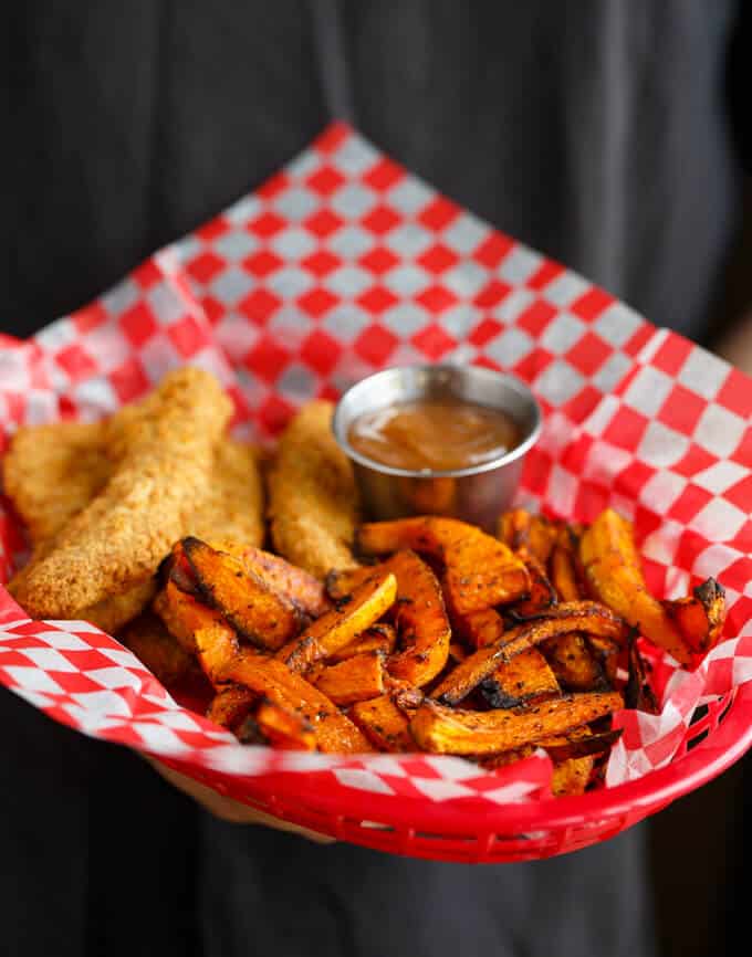 Butternut Squash Fries  with fried dish and dip on red basket with paper sheet#healthy