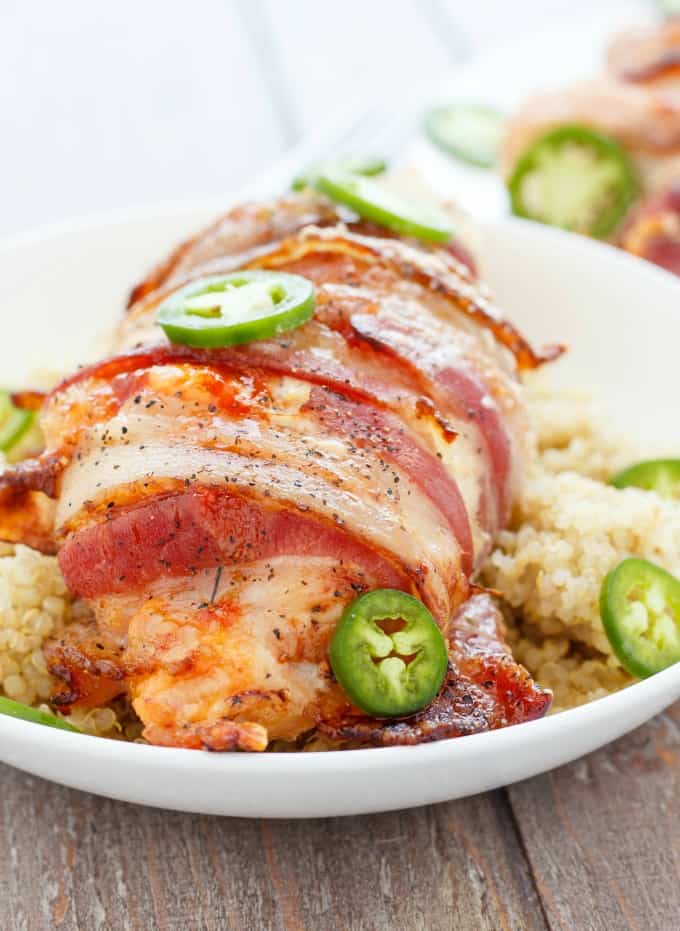 Jalapeno Popper Stuffed Chicken on white plate on wooden table#glutenfree