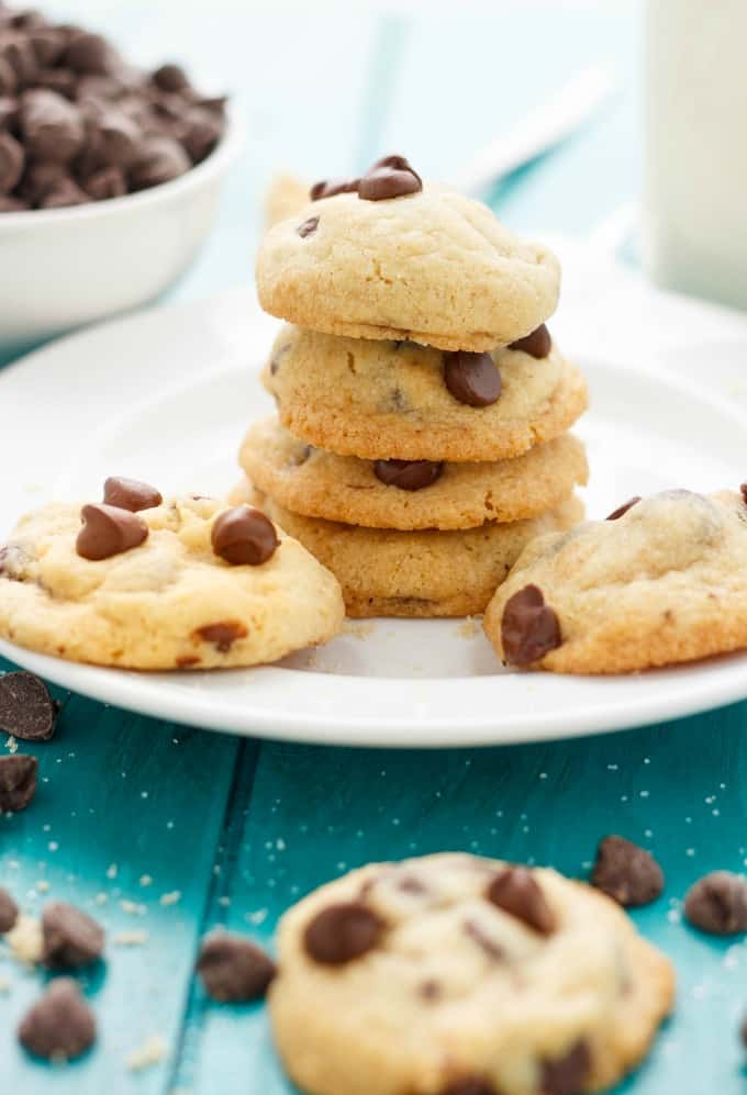 Soft and Chewy Chocolate Chip Cookies on white plate on blue table 