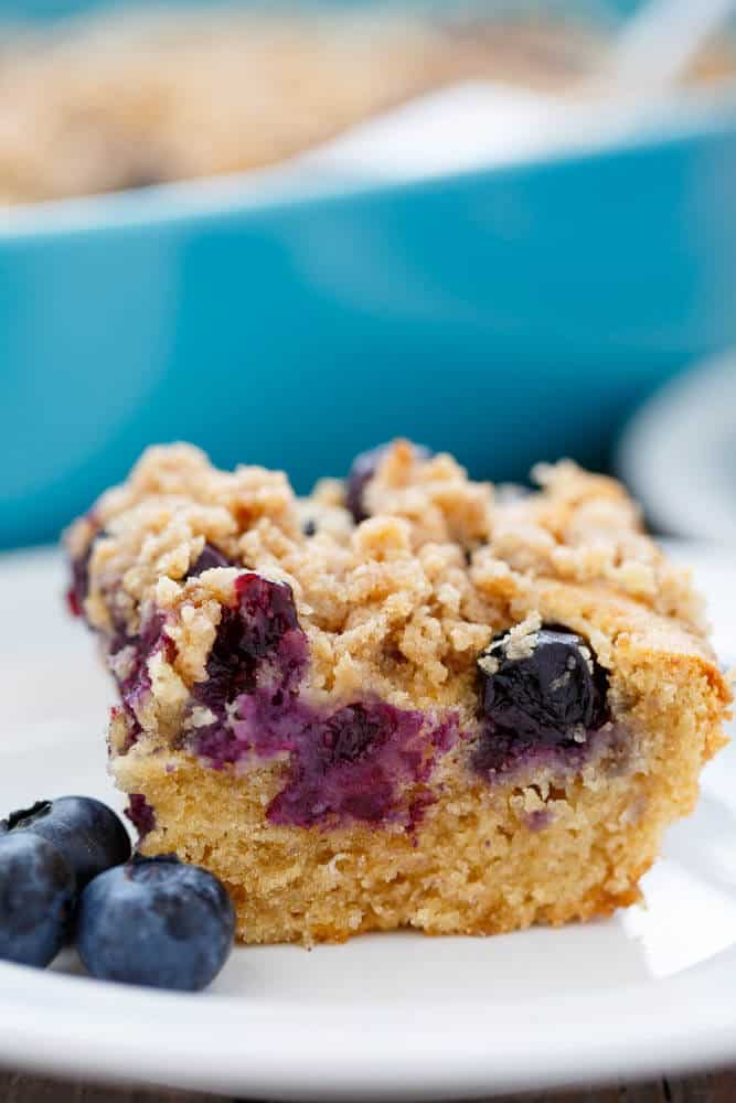 Blueberry Boy Bait cake slice on white plate with blueberries#dessert