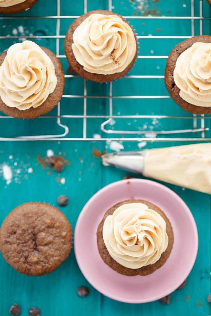 Gluten-Free Chocolate Cupcakes with Peanut Butter Frosting on pink plate on blue table  #chocolate