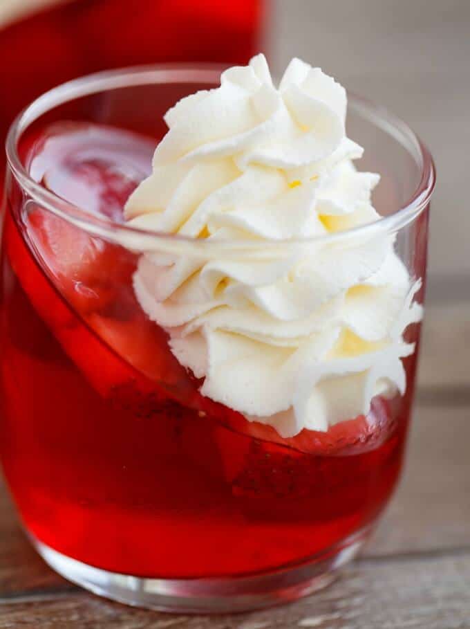 Strawberry and Raspberry Jell-O Parfaits with Almond Whipped Cream in glass on table#canadaday