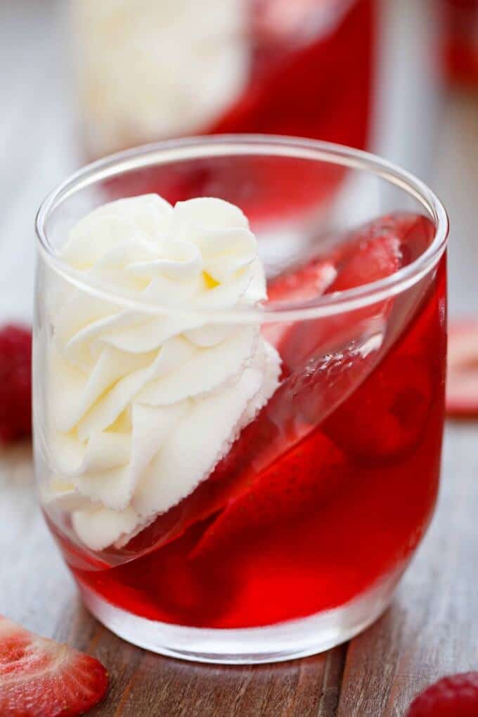 Strawberry and Raspberry Jell-O Parfaits with Almond Whipped Cream in glass with raspberries on table #dessert