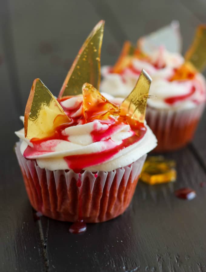 Halloween Cupcakes Blood Cupcakes with Broken Beer Bottle Glass Shards on black table