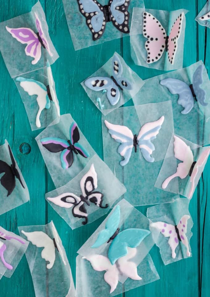 Royal Icing Butterflies on foil on green bakckground