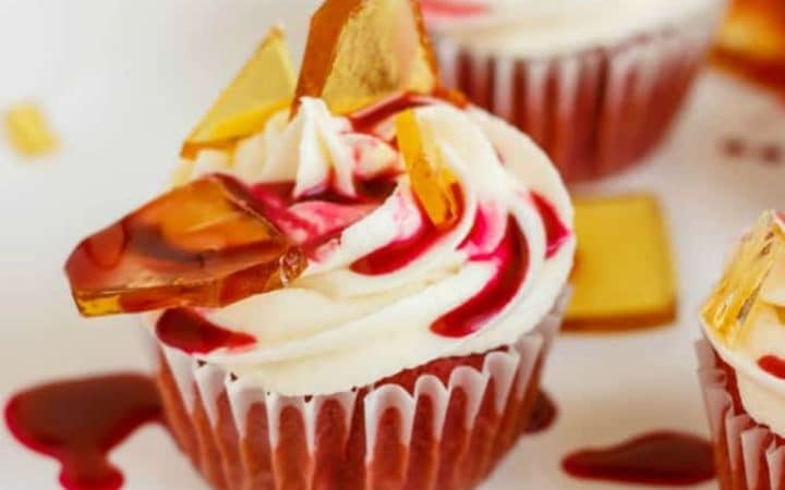 Halloween cupcakes with broken beer bottle shards on white plate