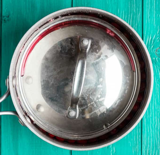 Pot with lid on blue table