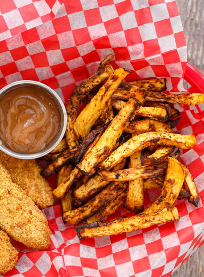 Rutabaga Fries  with fried dish and dip on paper sheet#healthy