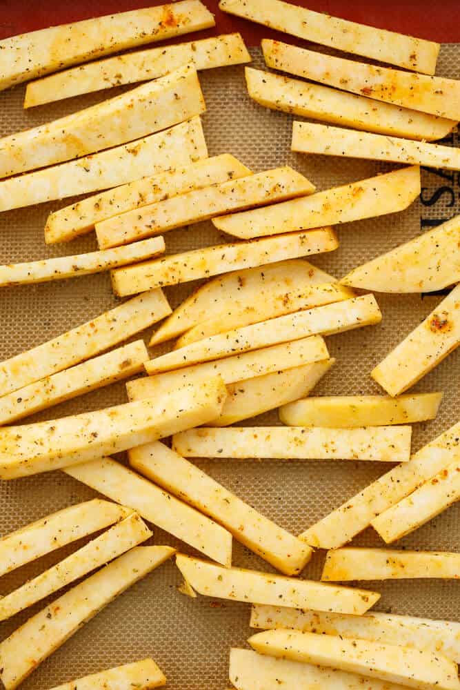 Rutabaga Fries  ready for oven on brown pad#vegan