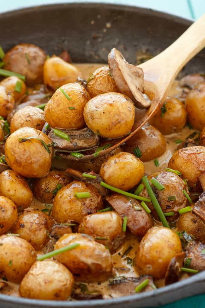 Roasted Baby Potatoes in a Homemade Mushroom Sauce in pot with wooden spatula#mushrooms