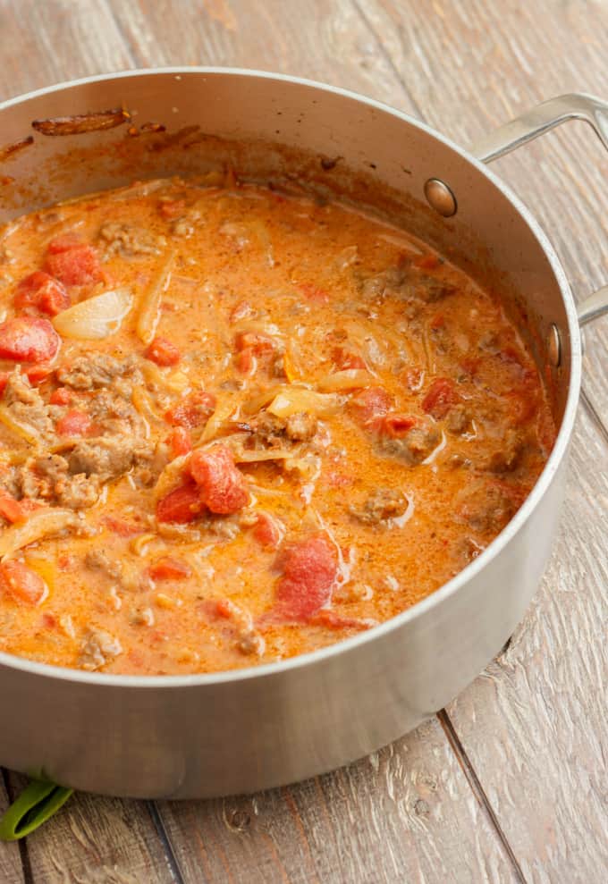 Sausage and Vodka Pasta Sauce in pot on wooden table