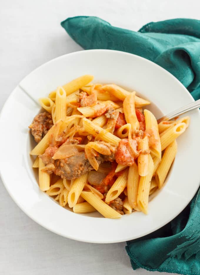 Sausage and Vodka Pasta Sauce with pasta on white plate