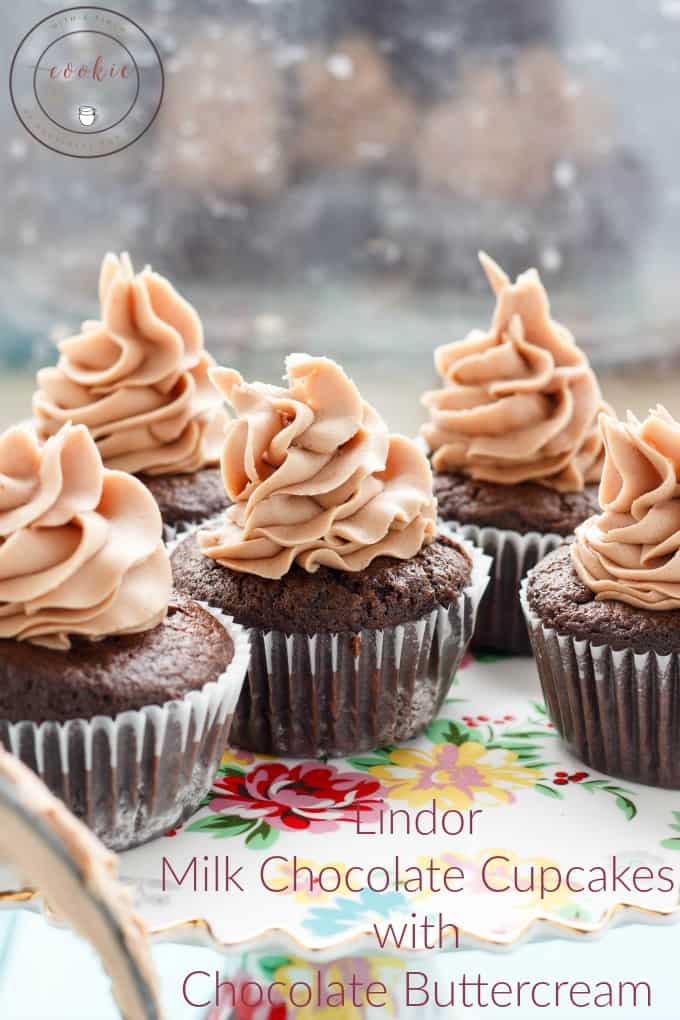 Lindor Milk Chocolate Cupcakes with Chocolate Buttercream on flowerish table cloth