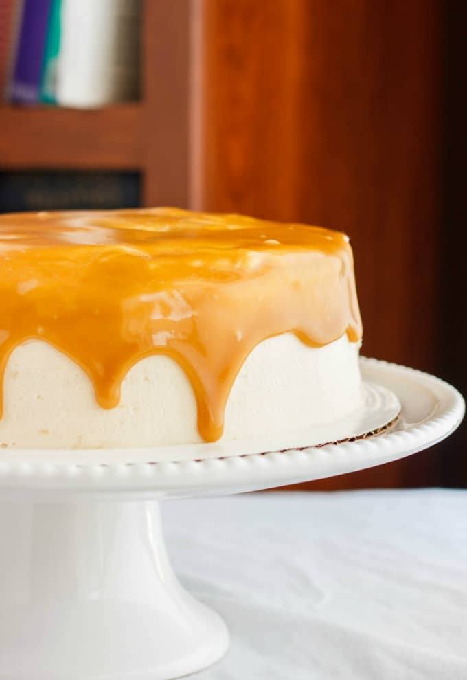 Caramel and Coffee Layer Cake with Coffee Buttercream on white tray on white table