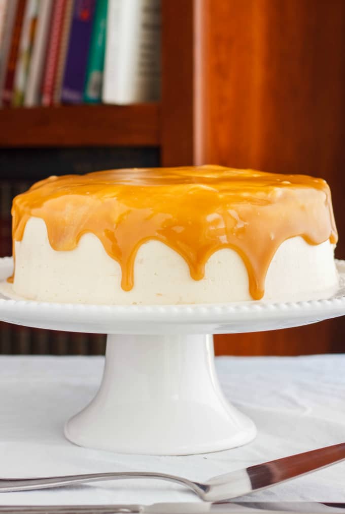 Caramel and Coffee Layer Cake with Coffee Buttercream on white tray on white table