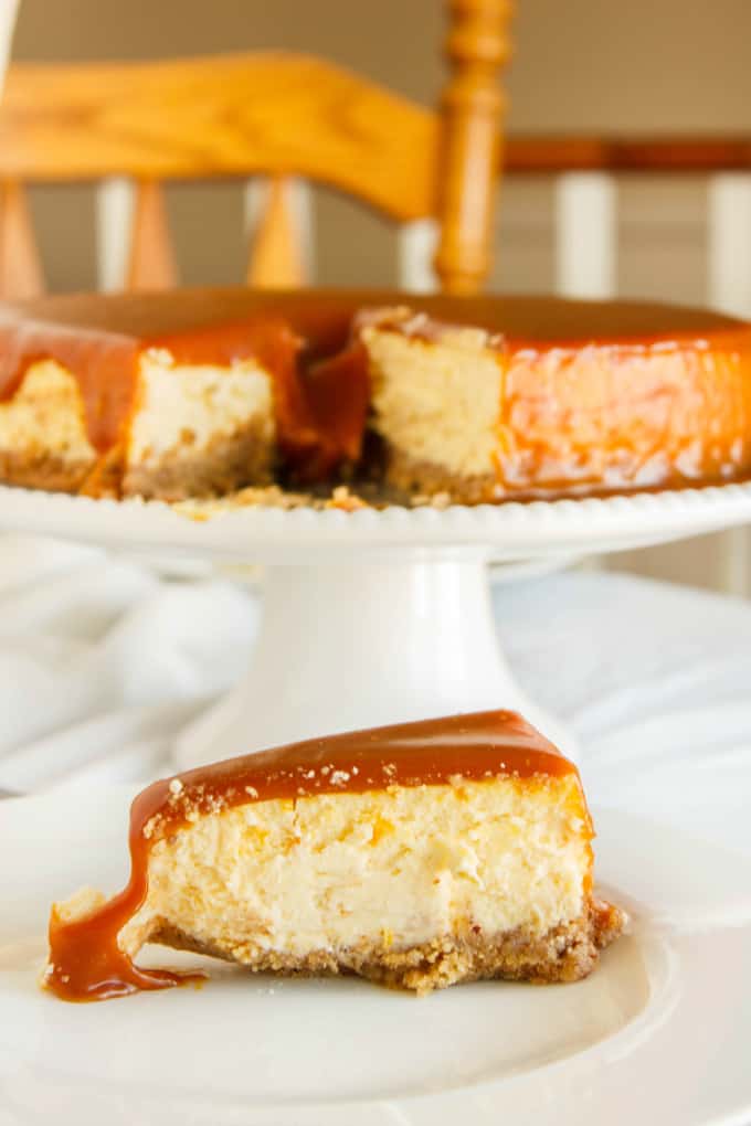 Salted Caramel Cheesecake on white plate and white tray on white table