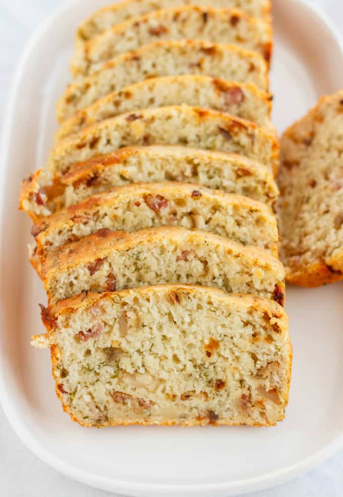 Beer, Bacon, and Parmesan Bread slices on white tray