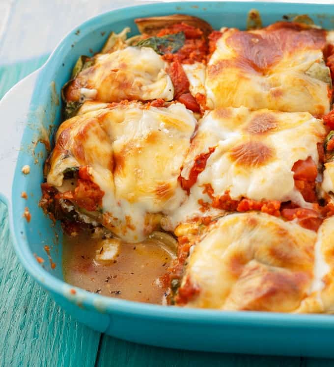 Eggplant and Zucchini Lasagna in blue baking pot on blue table