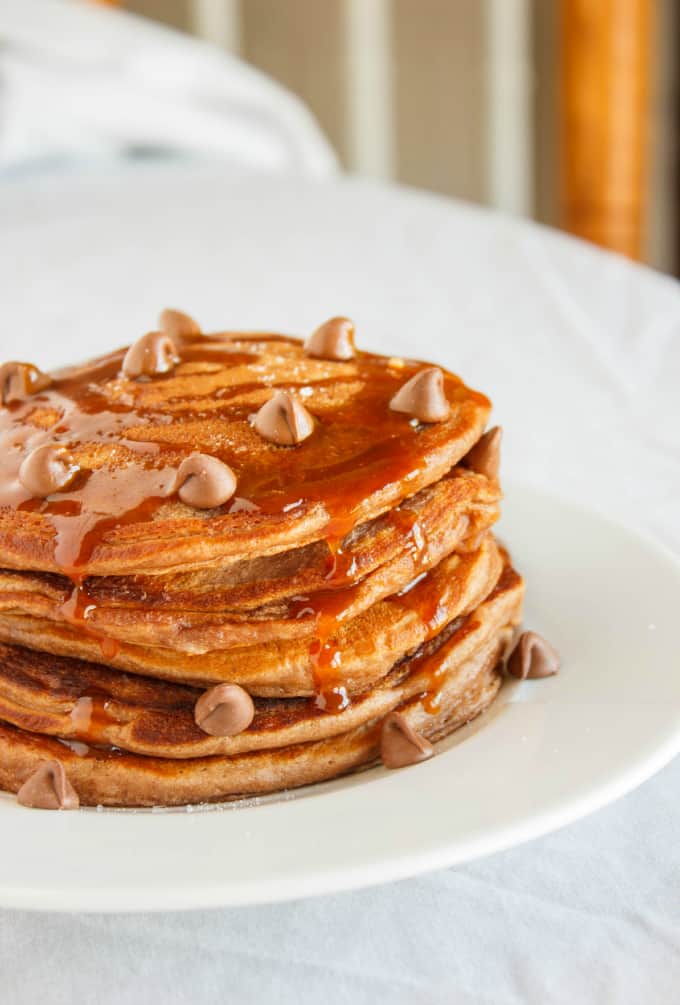 Salted Caramel Hot Chocolate Pancakes on white plate on white table