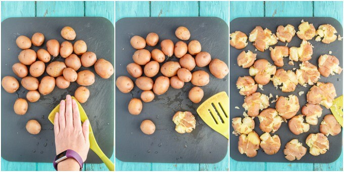 Cooked potatoes being smashed by spatula by hand