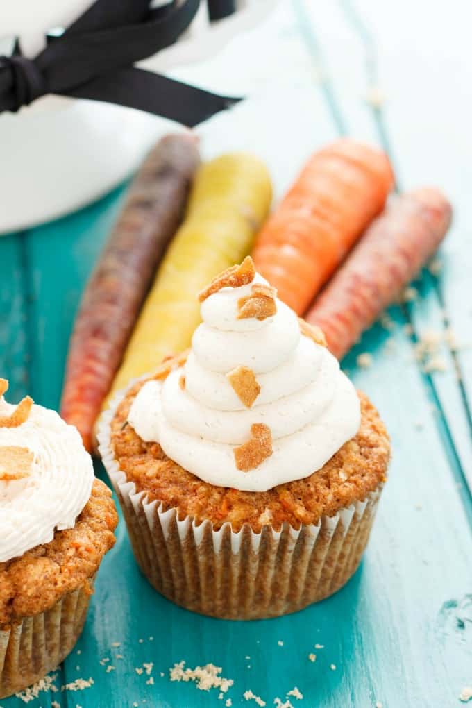 Carrot Cake Cupcakes with Brown Sugar Swiss Meringue Buttercream on blue desk with carrots#Easter  Carrot Cake Cupcakes with Brown Sugar Swis Carrot Cake Cupcakes with Brown Sugar Swiss Meringue Buttercream Easter