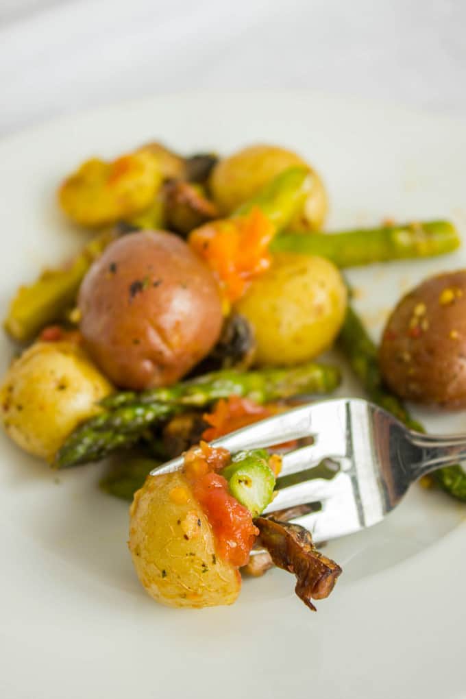 Easy Creamer Potatoes with Roasted Vegetables  picked on fork on white plate