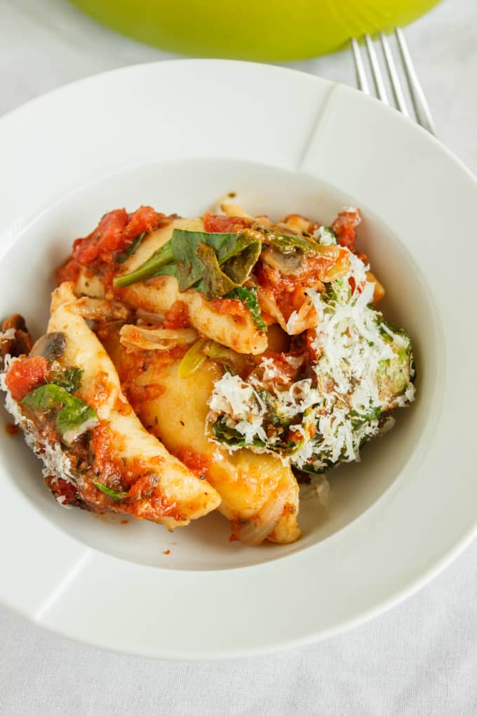 Oven-Baked Perogies in Tomato Sauce on white plate