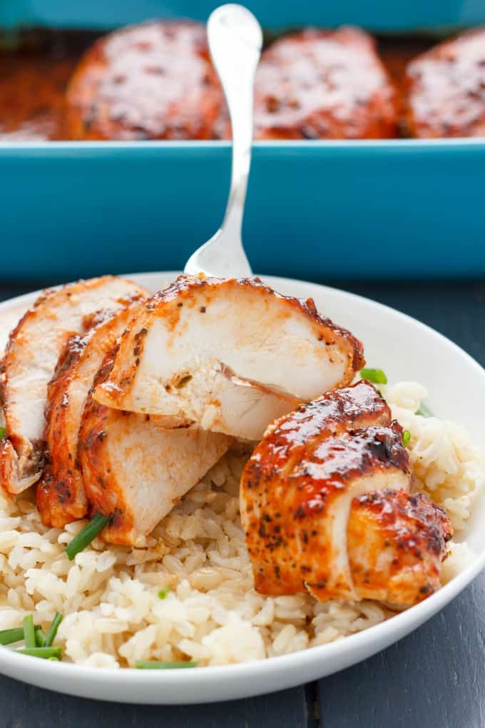 Sweet Sriracha Chicken Breasts with rice, vegetable and fork on white plate#spicy