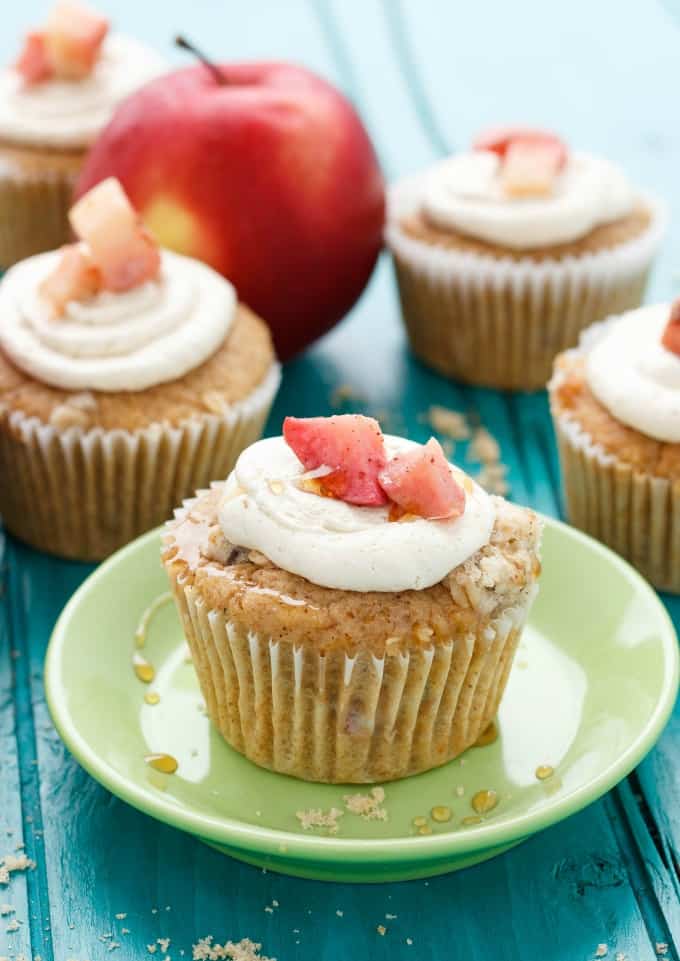 Apple Pie Cupcakes with a Crispy Topping on green small plate and on blue table with red apple#dessert