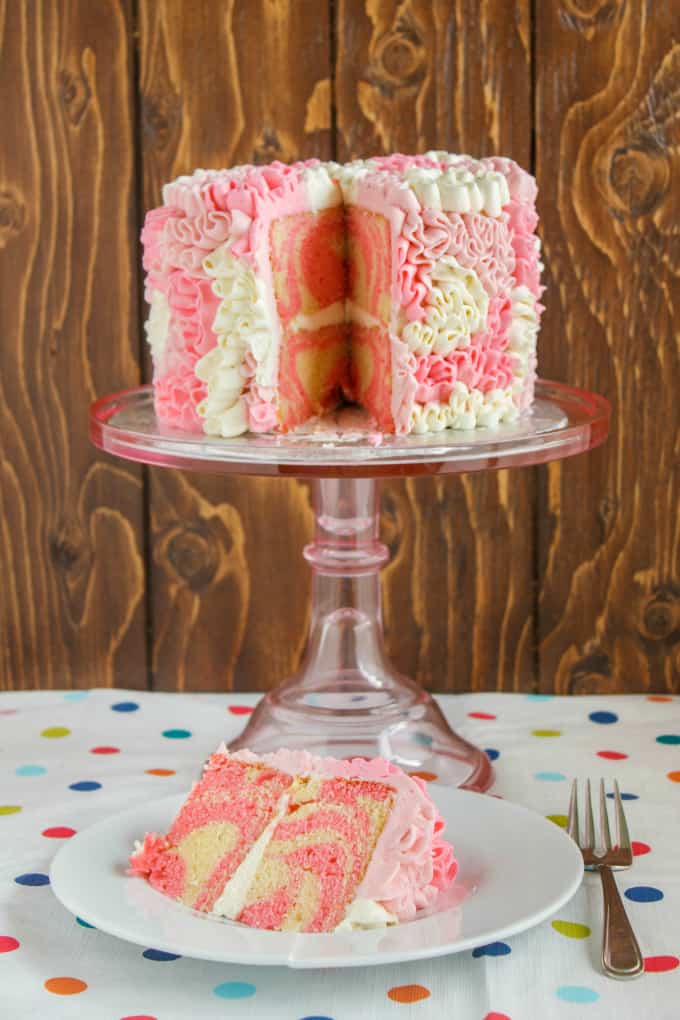 Zebra Cake with Messy Ruffles on glass tray with slice on white plate with fork