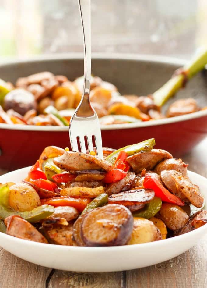 Breakfast Throw-Together Creamer Potatoes with Sausage and Peppers in pan and on white plate with fork#sausage