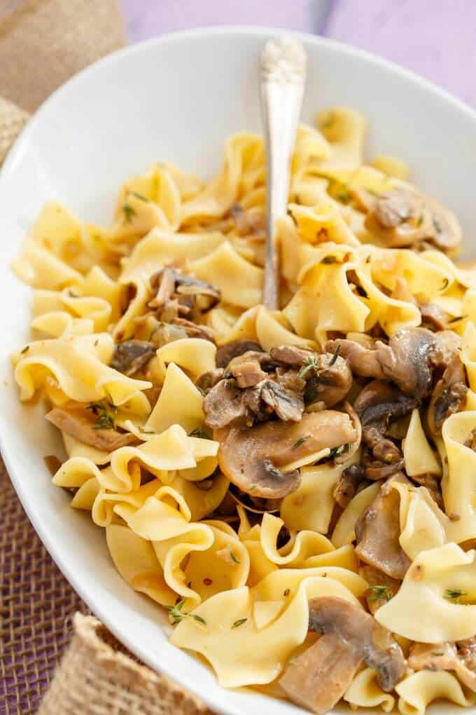 Mushroom Stroganoff  on white plate with spoon(Vegetarian)