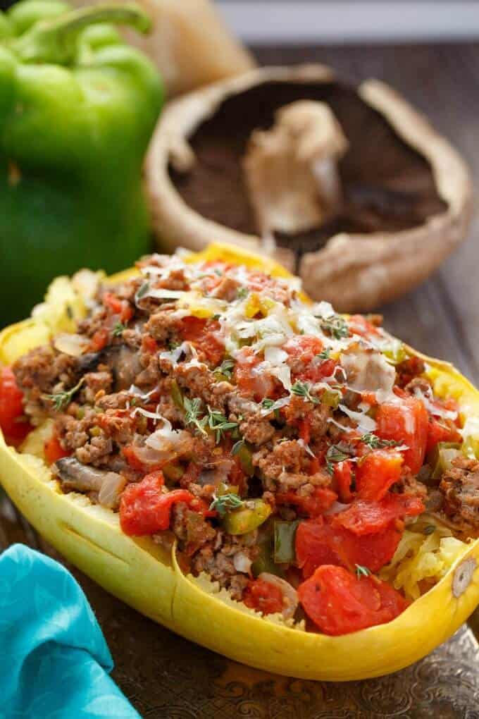 Stuffed Spaghetti Squash with Tomato and Ground Beef on wooden table